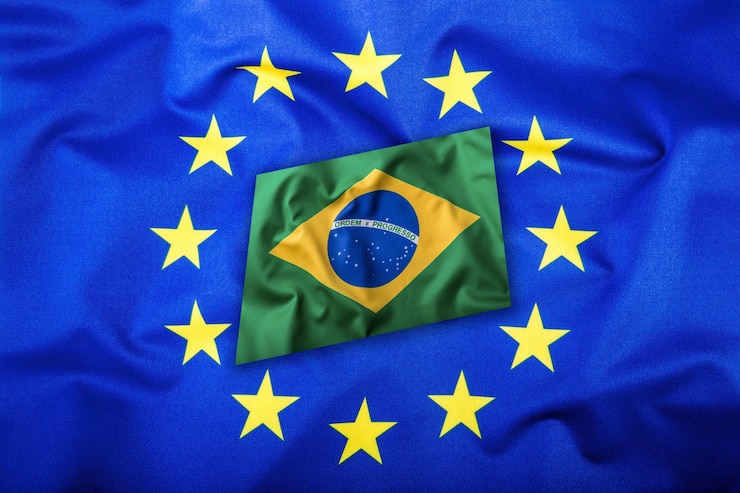 Foto bandeiras do brasil e da união européia. bandeira do brasil e bandeira da ue. bandeira brasileira dentro de estrelas. conceito de bandeira do mundo.