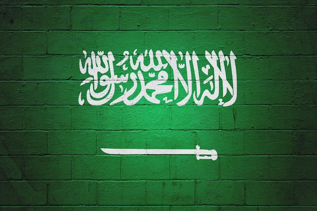 Bandera de Arabia Saudita pintada en una pared.