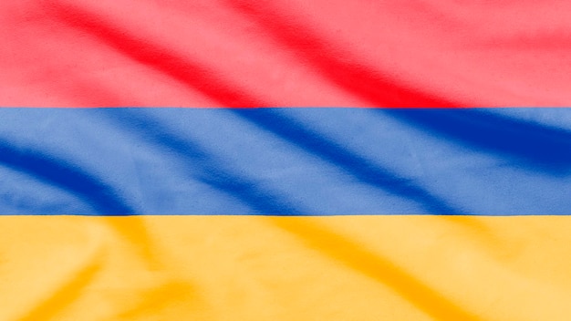 Bandera de Armenia sobre tela ondulada.