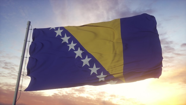 Bandera de Bosnia y Herzegovina ondeando en el fondo del viento, el cielo y el sol. Representación 3D.