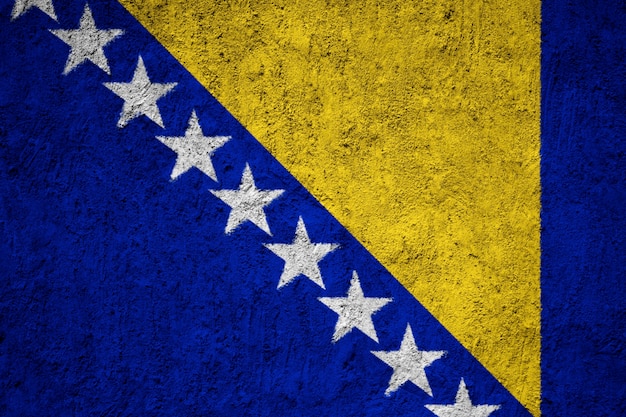 Foto bandera de bosnia y herzegovina pintada en la pared de grunge