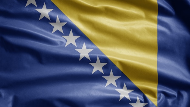 Foto bandera de bosnia ondeando en el viento