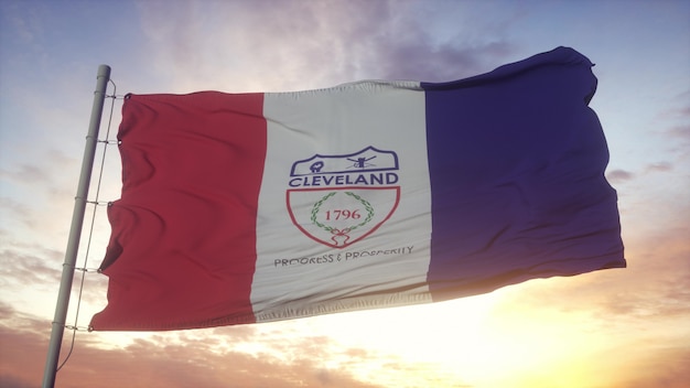 Bandera de Cleveland, ciudad de Ohio ondeando en el fondo del viento, el cielo y el sol. Representación 3d