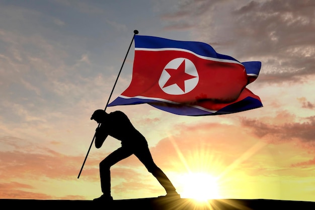 Bandera de Corea del Norte empujada al suelo por una silueta masculina 3D Rendering