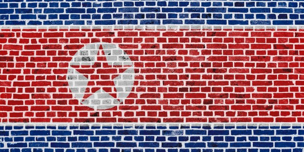 Bandera de Corea del Norte pintada en una pared de ladrillos