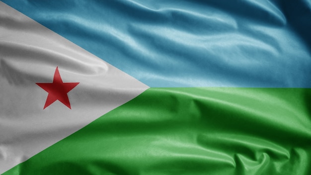 Bandera de Djibouti ondeando en el viento. Plantilla de Djibouti que sopla, seda suave y lisa. Fondo de la bandera de la textura de la tela del paño. Úselo para el concepto de ocasiones de día nacional y país.