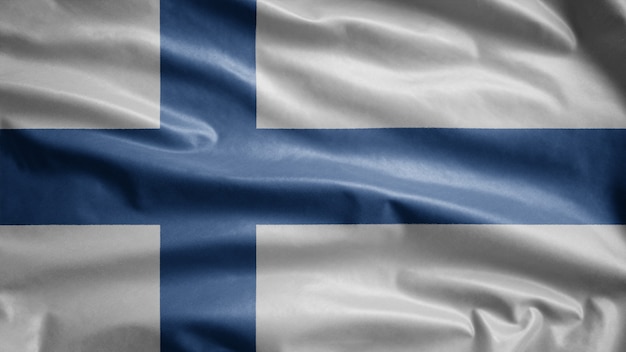 Foto bandera de finlandia ondeando en el viento. cerca de finlandia bandera que sopla, seda suave y lisa.