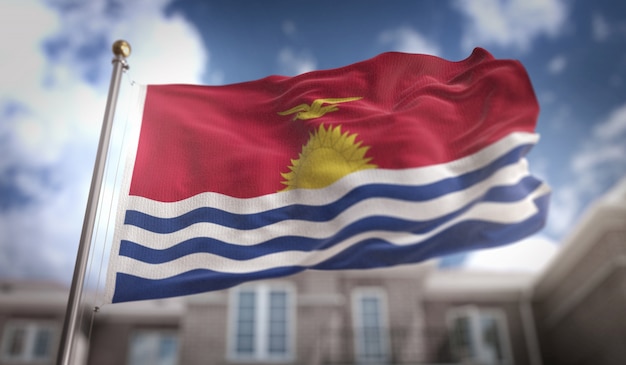 Bandera de Kiribati Representación 3D sobre el fondo del edificio de cielo azul