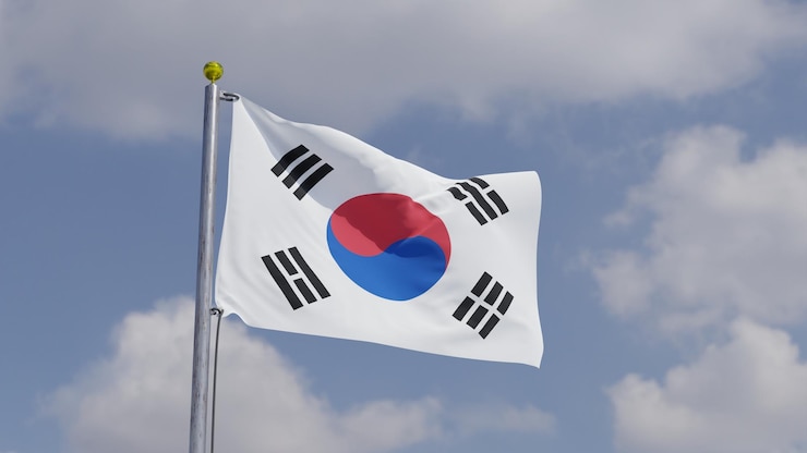 Foto bandera de korea del sur ondeando en un poste de bandera cielo de fondo con nubes