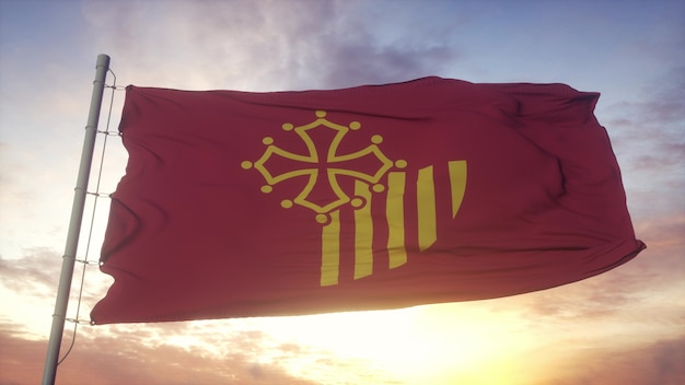 Bandera de Languedoc-Rosellón, Francia, ondeando en el fondo del viento, el cielo y el sol. Representación 3d