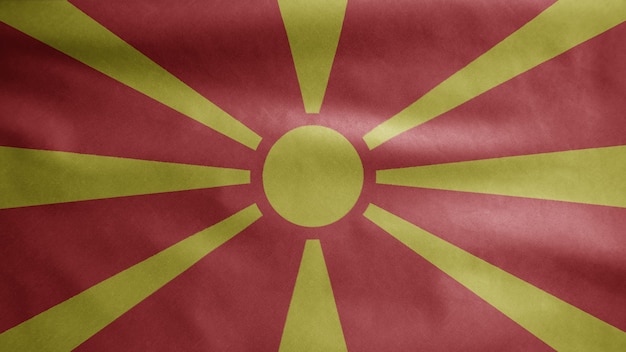 Bandera de Macedonia ondeando en el viento. Bandera de Macedonia del norte que sopla seda suave. Fondo de la bandera de la textura de la tela del paño.