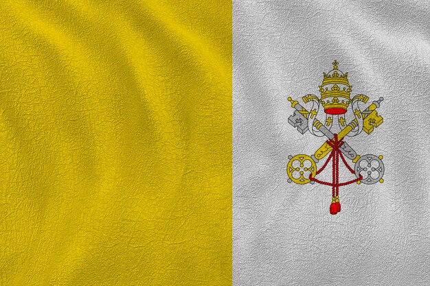 Foto bandera nacional de la ciudad del vaticano fondo con la bandera de la ciudad del vaticano