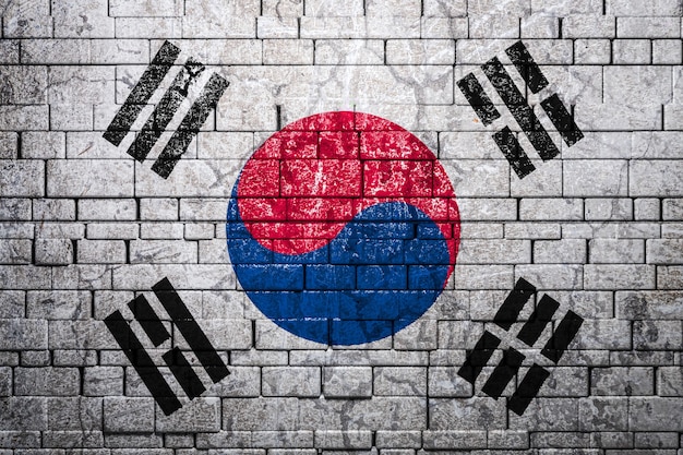 Bandera nacional de Corea del sur en la pared de ladrillo. El concepto de orgullo nacional y símbolo del país.