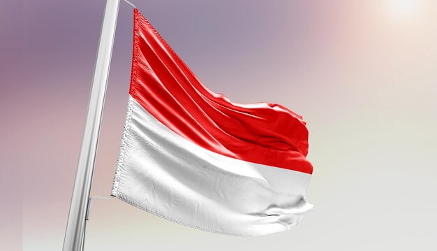 Foto la bandera nacional de indonesia ondeando en el cielo