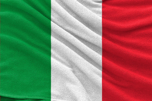 Foto la bandera nacional de italia con textura ondulada de tela