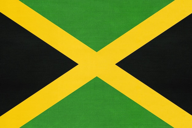 Bandera nacional de tela de Jamaica, fondo textil. Símbolo del país del mundo de América del Norte.