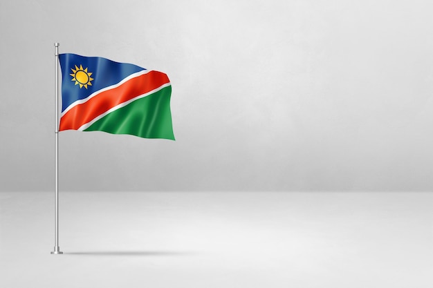 Bandera de Namibia aislado sobre fondo de pared de hormigón blanco