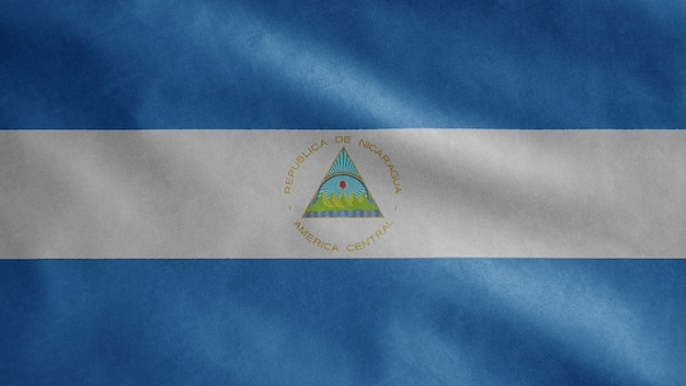 Bandera de Nicaragua ondeando en el viento. Cerca de plantilla de Nicaragua soplado, seda suave y lisa. Fondo de la bandera de la textura de la tela del paño. Úselo para el concepto de ocasiones de día nacional y país