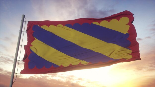 Bandera de Nivernais, Francia, ondeando en el fondo del viento, el cielo y el sol. Representación 3d