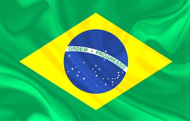 Bandera del país de Brasil sobre fondo de textiles de seda ondulada