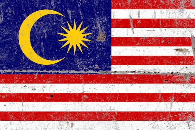 Bandera rústica de malasia pintada en una hoja de metal vieja