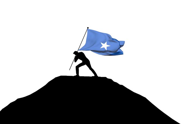 Foto bandera de somalia empujada a la cima de la montaña por una silueta masculina 3d rendering