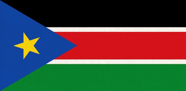 Bandera de Sudán del Sur Bandera sudanesa en la superficie de la tela Textura de la tela