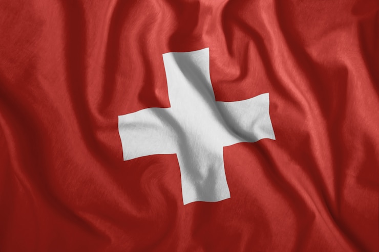 Foto la bandera suiza ondea en el viento