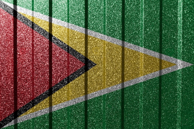 Bandera texturizada de Guyana en la pared de metal Fondo geométrico abstracto natural colorido con líneas