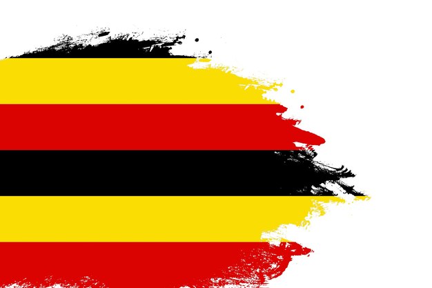 Bandera de Uganda en un pincel de trazo manchado pintado fondo blanco aislado con espacio de copia