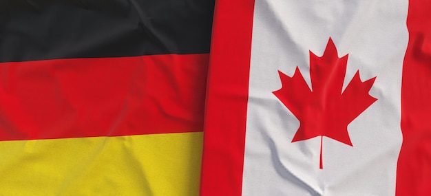 Foto banderas de alemania y canadá bandera de lino de primer plano bandera hecha de lienzo alemán berlín estado canadiense símbolos nacionales ilustración 3d