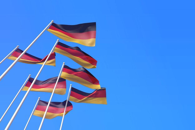 Banderas de Alemania ondeando en el viento contra un cielo azul d renderizado