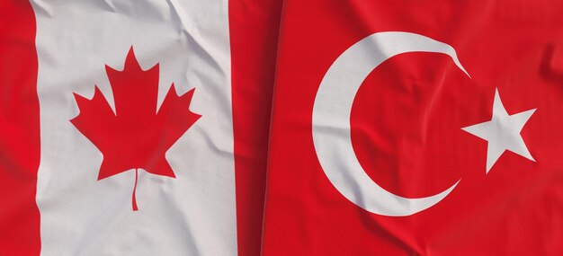 Banderas de Canadá y Turquía Primer plano de la bandera de lino Bandera hecha de lona Ottawa canadiense Hoja de arce Ankara turca Ilustración 3d