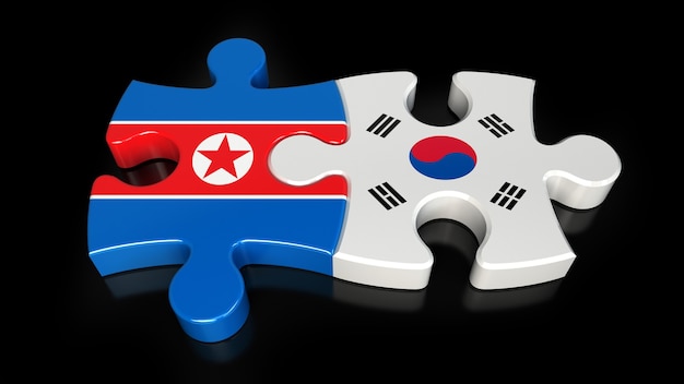 Foto banderas de corea del sur y corea del norte en piezas de un rompecabezas. concepto de relación política. representación 3d