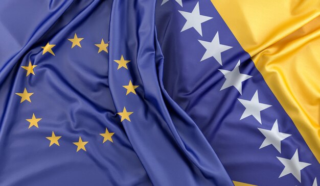 Banderas enroscadas de la Unión Europea y Bosnia y Herzegovina Renderizado en 3D