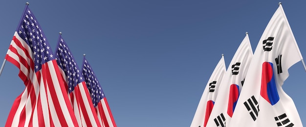 Banderas de los Estados Unidos y Corea del Sur en astas de bandera en los lados Seis banderas sobre un fondo azul Lugar para texto Estados Unidos de América Seúl Ilustración 3D