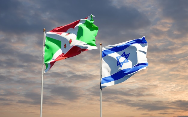 Banderas estatales de Israel y Burundi juntos sobre fondo de cielo