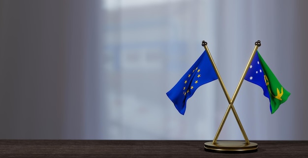 Banderas de la Isla de Navidad y Europa en la mesa Negociación entre la Isla de Navidad y la UE