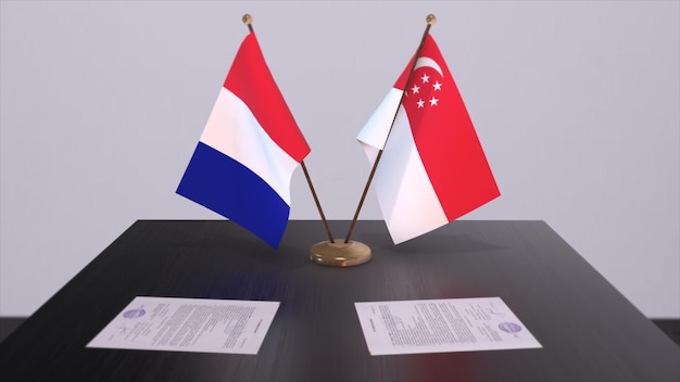 Banderas nacionales de Singapur y Francia en la mesa en la sala de conferencias diplomática Acuerdo de trato político