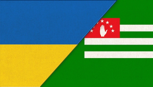 Las banderas de Ucrania y Abjasia en la ilustración Textura de la tela