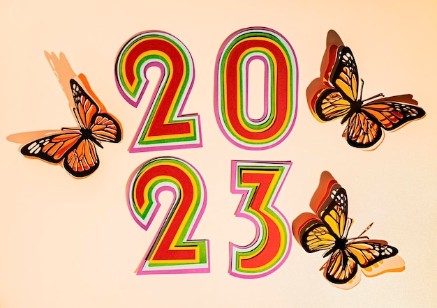Banner de año nuevo 2023 Números de corte de papel con colores brillantes Plantilla de diseño de cubierta mínima para folletos de tarjetas de felicitación de Navidad