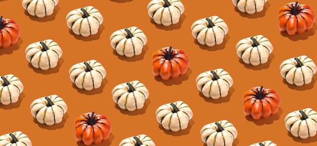 Banner con patrón de calabazas naranjas y blancas en fondo naranja Papel de pared Concepto de fondo de Halloween