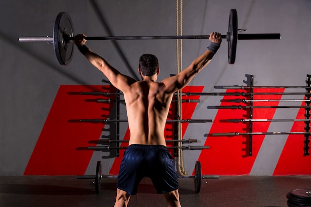 barbell musculação homem vista traseira treino ginásio