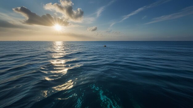 Foto un barco en el océano con el sol detrás de él