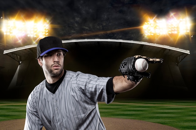 Foto baseballspieler auf einer blauen uniform auf baseballstadion.