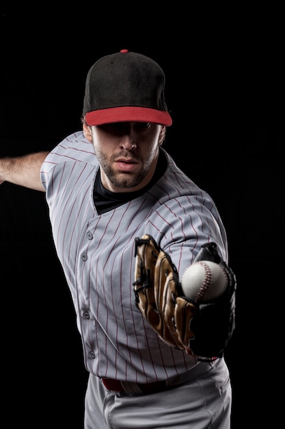 Baseballspieler, der einen Ball fängt. Studioaufnahme.