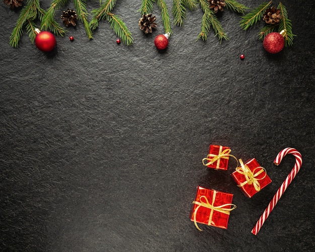 Bastón de caramelo, con regalos, decorado con ramas de árboles de Navidad un