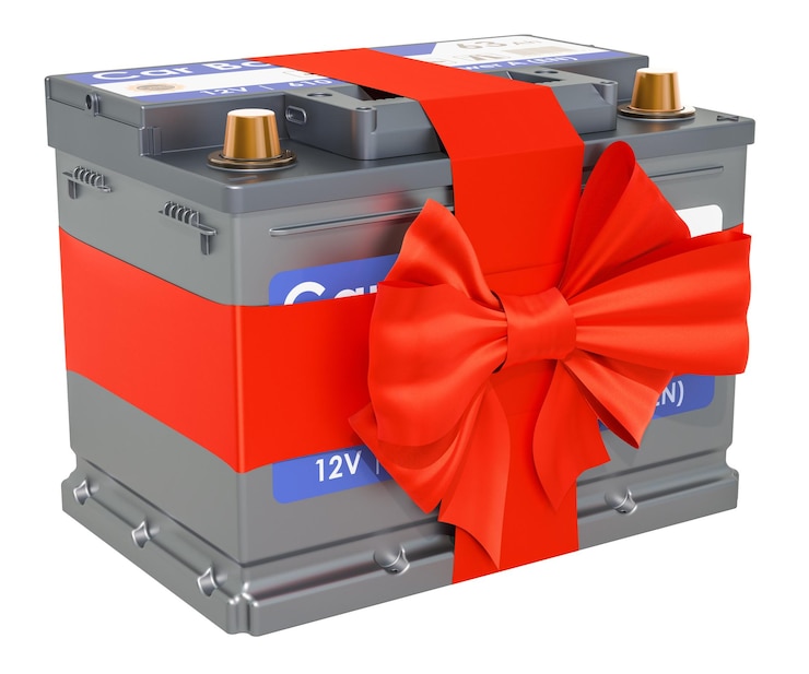 Foto bateria de carro com renderização em 3d do conceito de presente de arco e fita