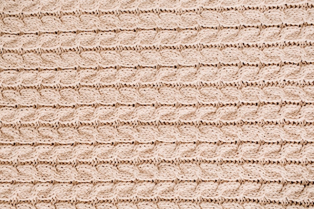 Beige gestrickte Wollstruktur mit Muster