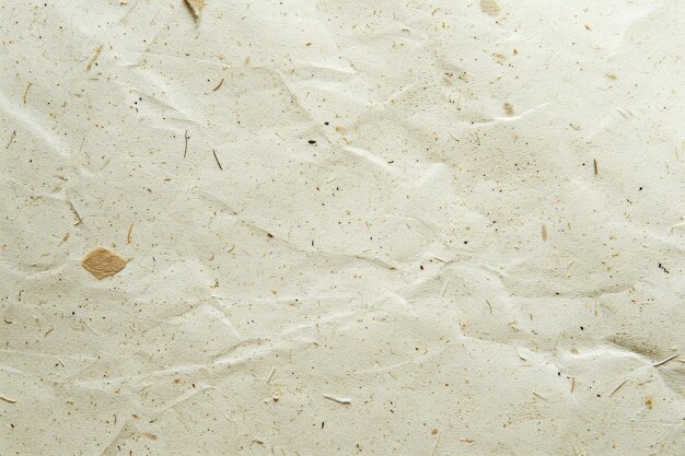 Foto beige öko-texturpapierblatt mit abstrakten partikeln